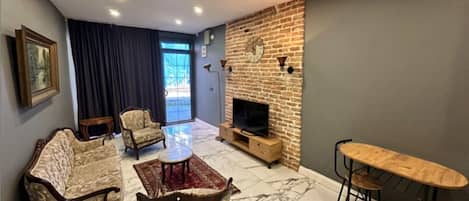 Superior Suite Annex Building | Living area | 50-inch LCD TV with satellite channels