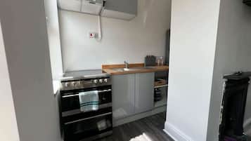 Fridge, oven, electric kettle, cookware/dishes/utensils