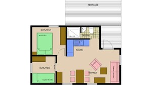 Ein Grundriss eines Hotels mit beschrifteten Räumen, darunter eine Terrasse, zwei Schlafzimmer, ein Badezimmer, eine Küche und ein Wohnbereich.