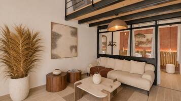 Design Loft, Garden View | Living area | 110-cm LED TV with cable channels