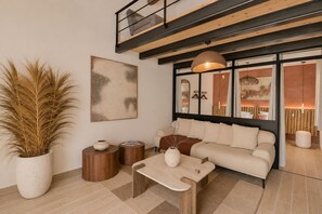 Design Loft, Garden View | Living area | 110-cm LED TV with cable channels