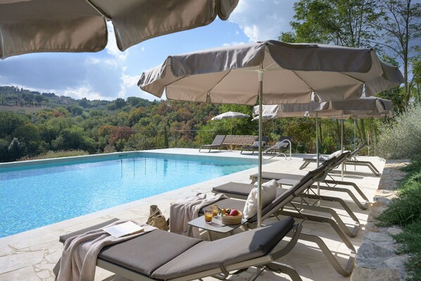 Seasonal outdoor pool, pool umbrellas, sun loungers
