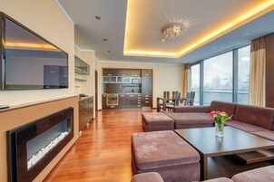 Premium Apartment | Living area | 32-inch Smart TV with cable channels, streaming services