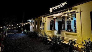A building with a sign reading "Coconut Creek" and a slogan "Home stay is here to stay". - Coconut Creek Homestay (Kottayam)