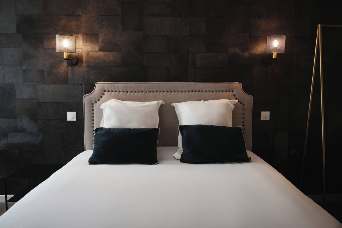 Premium bedding, desk, laptop workspace, soundproofing