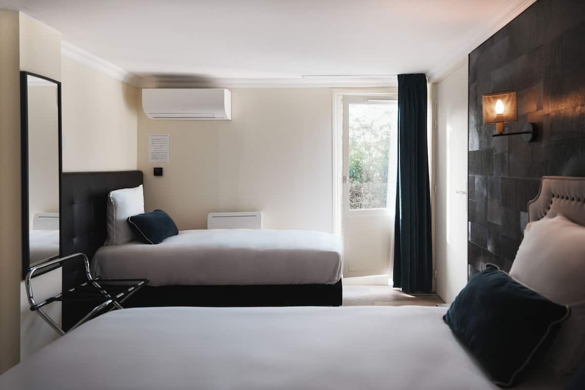 Comfort Triple Room | Premium bedding, desk, laptop workspace, soundproofing