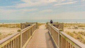 A wooden boardwalk leading to a beach with a clear sky. - New Listing! Meridian Plaza Resort #606 (Myrtle Beach)