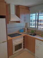 Apartment, Sea View, Corner | Private kitchen | Full-size fridge, microwave, oven, stovetop
