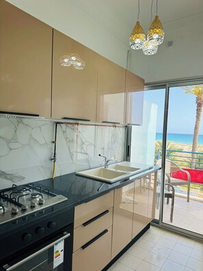 Fridge, stovetop, highchair, cookware/dishes/utensils