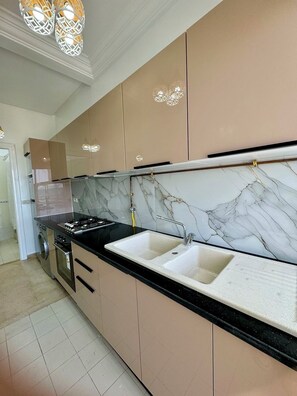 Fridge, stovetop, high chair, cookware/dishes/utensils