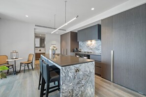 Microwave, dishwasher, coffee/tea maker, cookware/dishes/utensils