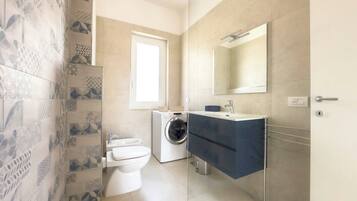 Hair dryer, bidet, towels, soap