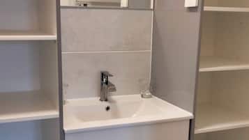 Ducha, secador de pelo, toallas