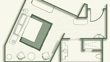 A floor plan of a hotel room with a large bed, a small bathroom, and a seating area with a table and chairs.
