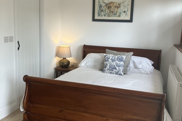 Beautiful white Linen in a King size sleigh bed