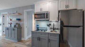 Fridge, microwave, stovetop, coffee/tea maker