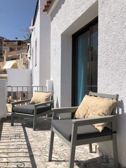 Lovely two bedroom villa. South facing sunny private terrace. Very accessible