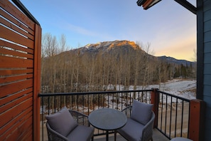 A balcony with a view of a mountain.