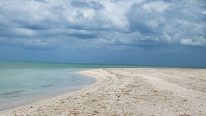 A beach with a clear sky and calm sea. - Ocean Front, Accessible, 3-bdrm Home!  (Celestún)