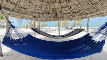 On the beach, sun loungers, beach towels