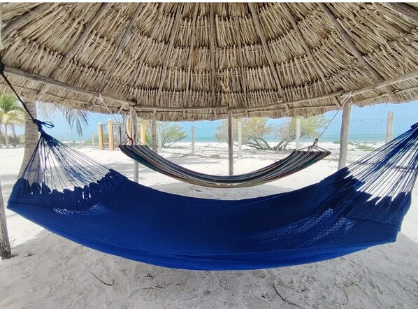 On the beach, sun-loungers, beach towels