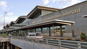 The exterior of Ninoy Aquino International Airport with a modern design, featuring a covered walkway and a clear sky. - 101 Newport Blvd: SkyStag Aerie - A cozy studio near NAIA Terminal 3 Airport (Pasay)