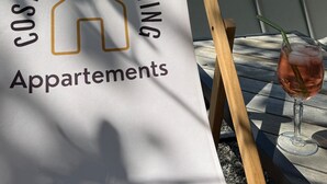 A sign for 'Cozy Comfort Living Apartments' with a pool view. - Apartment 'Bergblick' with Shared Terrace, Sauna, Whirlpool & Pool (Stockach)
