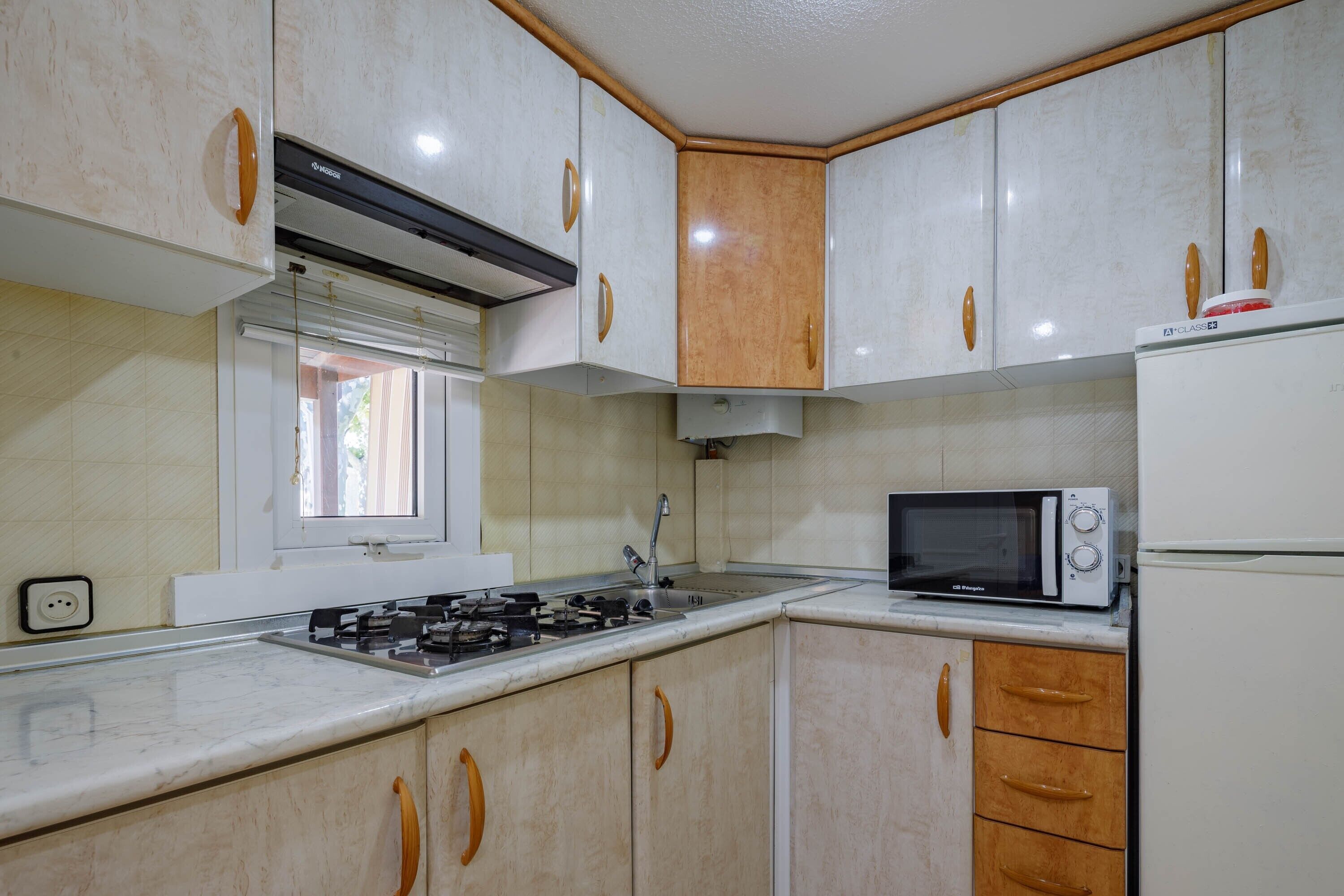 Fridge, microwave, stovetop, coffee/tea maker