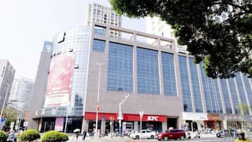A multi-story building with a KFC restaurant on the ground floor.