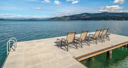 Waterfront home in Sagle with a dock, hot tub, and large lawn for families