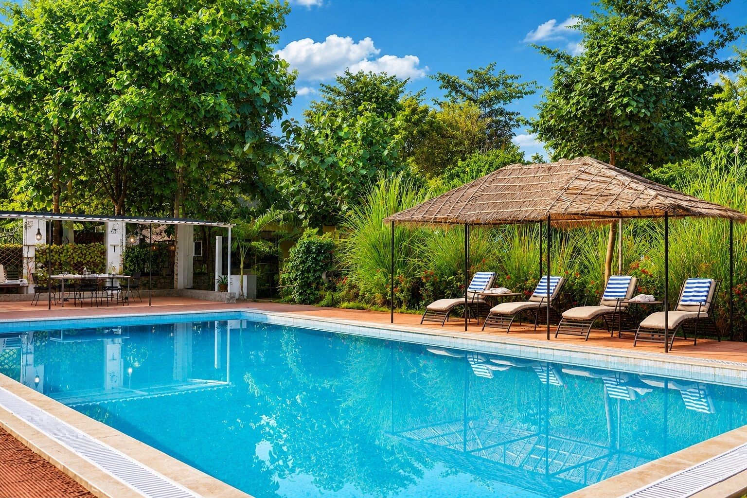 A swimming pool with lounge chairs and a gazebo.