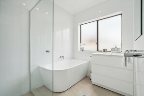 Shower, hair dryer, towels, shampoo