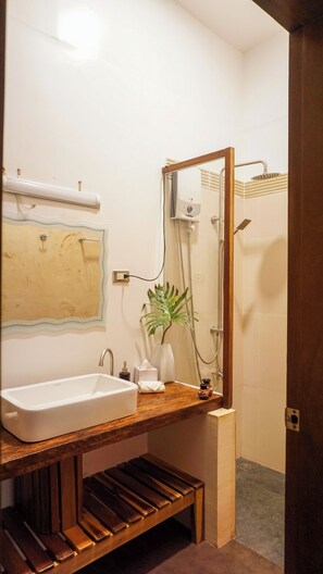 Studio Suite, Pool View | Bathroom | Shower, slippers, towels, soap - La Colonial Resort (El Nido)