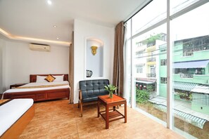 Family Room | Minibar, desk, free WiFi, bed sheets - Queen Hotel Saigon Airport (Ho Chi Minh City)