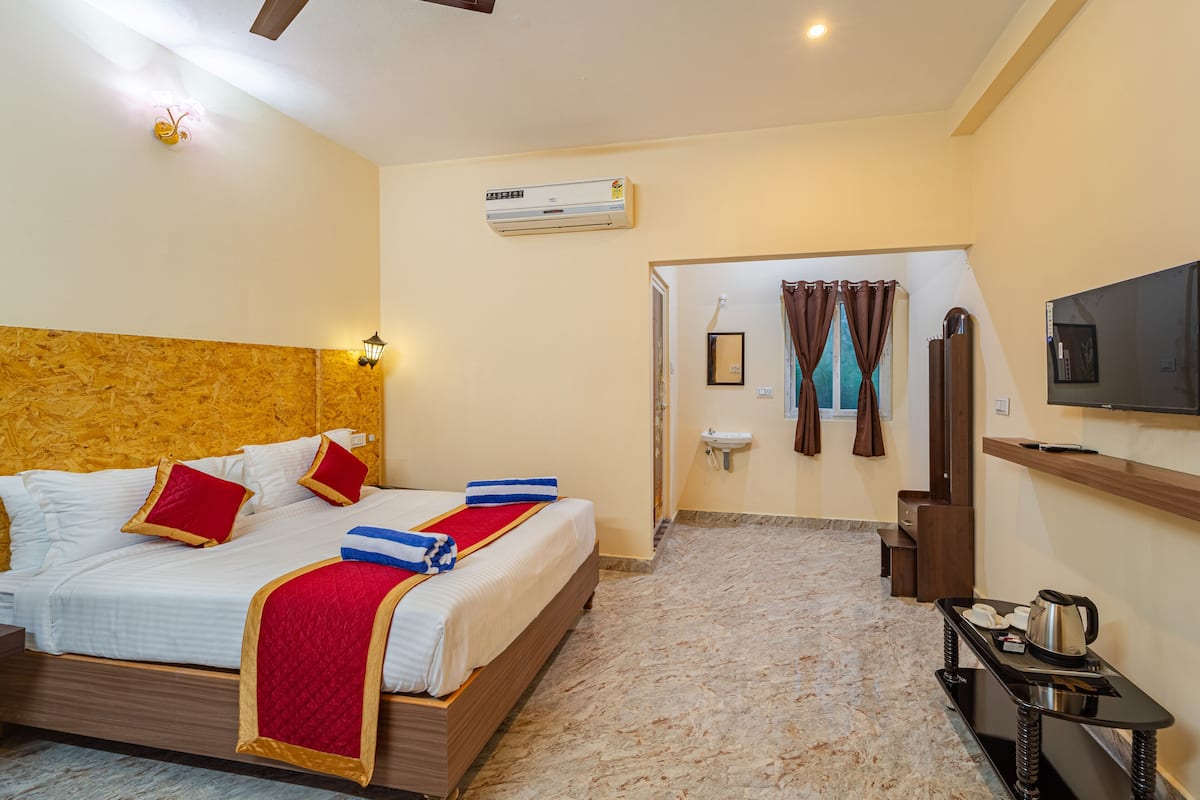 Chambre Deluxe double, vue sur le jardin | Bureau, fer et planche Ă repasser, accĂšs au Wi-Fi (inclus)