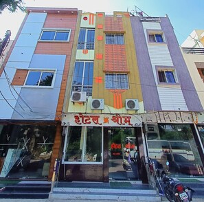 Stylish building with a mix of architectural styles and a ground-level commercial space.
