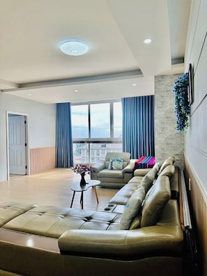 Family Apartment, Ocean View | Living area | 55-inch Smart TV with cable channels - Oasky Apartment Vung Tau (Ho Chi Minh City)