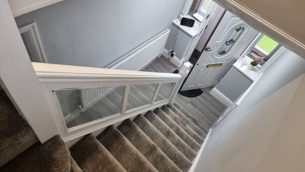 A staircase with a white handrail leading to a landing. - Victoria Avenue Charm - Manchester Hideaway (Manchester)