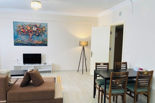 Family Apartment, Balcony, Garden View | Living area | TV