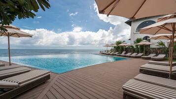 2 outdoor pools, pool umbrellas, pool loungers