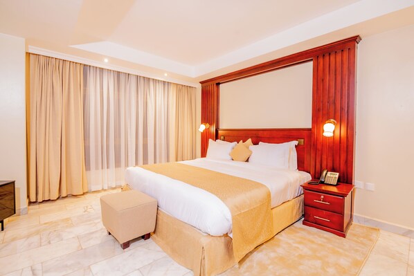 In-room safe, desk, laptop workspace, blackout curtains - The Grandville Manor (Kampala)