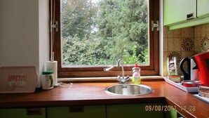 A kitchen with a window, a sink, and a countertop. - House Rumpen 10 single beds 7 bedrooms with hot and cold water Brunssum  (Brunssum)
