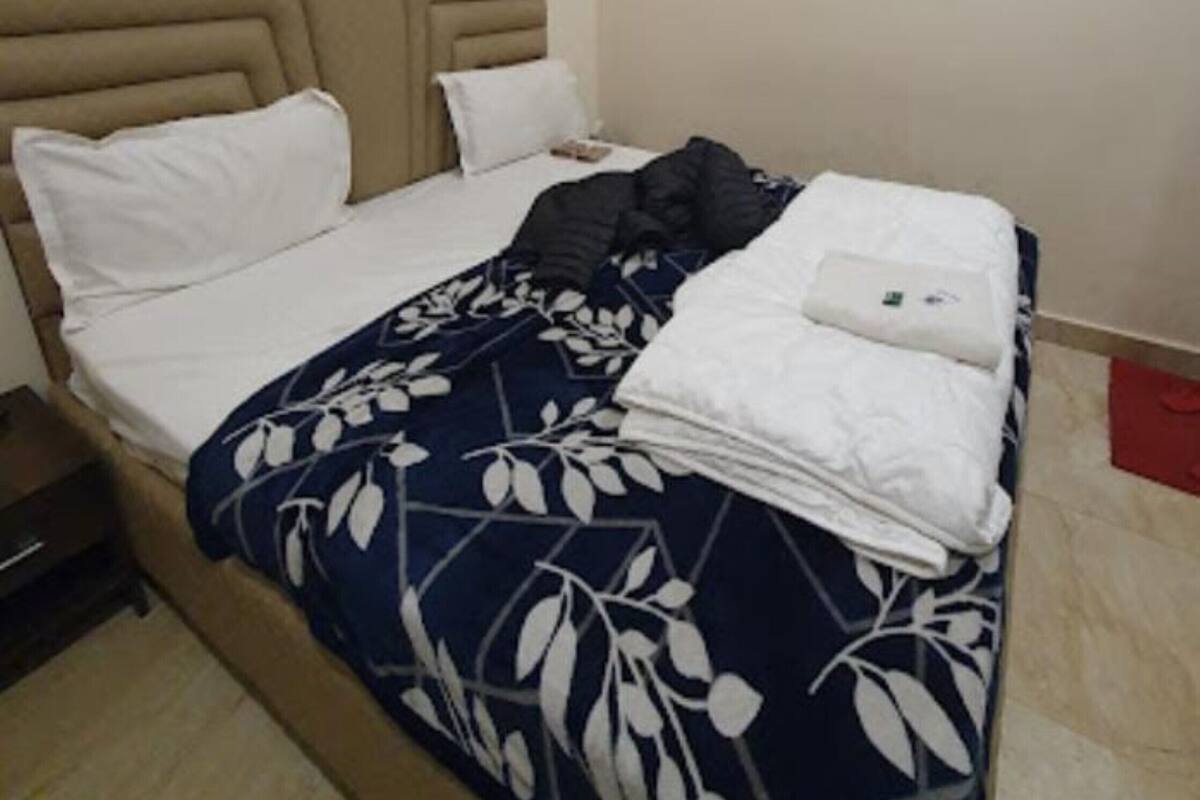 Habitación Deluxe doble, varias habitaciones, vistas a la ciudad | Sistema de insonorización, wifi gratis, ropa de cama