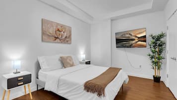 1 bedroom, desk, iron/ironing board, travel crib