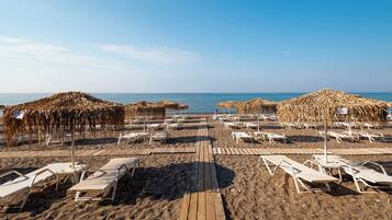 Beach nearby, black sand, sun-loungers, beach umbrellas