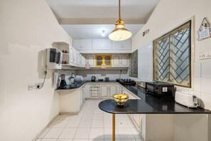 Fridge, microwave, stovetop, coffee/tea maker