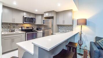 Coffee/tea maker, fridge, microwave, oven