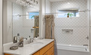 Shower, hair dryer, towels, shampoo