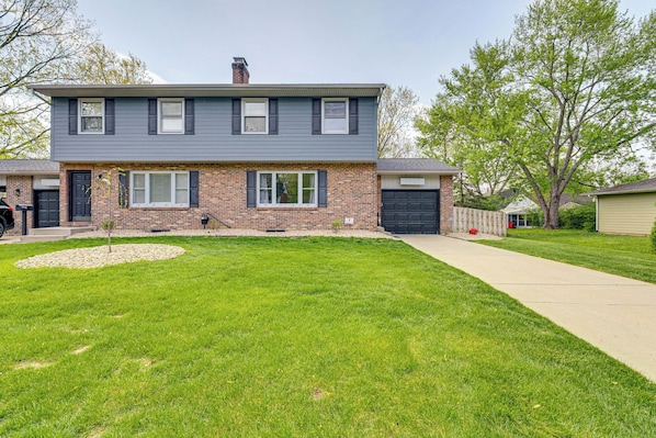 A two-story house with a brick facade and a grey roof. - 11 Mi to Dtwn Columbus: Peaceful Townhome w/ Yard! (Columbus)