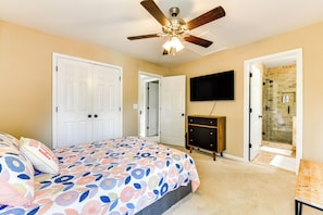 A bedroom with a bed, a ceiling fan, a TV mounted on the wall, and a shower area. - 2 Mi to Lake Norman: Home w/ Deck in Huntersville! (Huntersville)